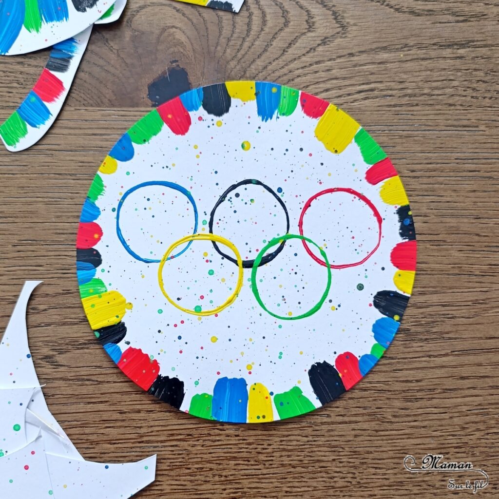 Peindre les anneaux olympiques avec un rouleau de PQ en carton : activité créative, peinture et manuelle enfants - Peinture avec des rouleaux de papier toilettes en carton et un pinceau - Peinture éclaboussée et aquarelle - Recyclage et surcyclage - Ronds, cercles, géométrie - Thème jeux olympiques, sports - Bricolage sympa et facile - Arts visuels Maternelle et cycle 2 - Arts visuels et atelier Maternelle et élémentaire - Créativité - Cycle 1 ou 2 - tutoriel photos - mslf