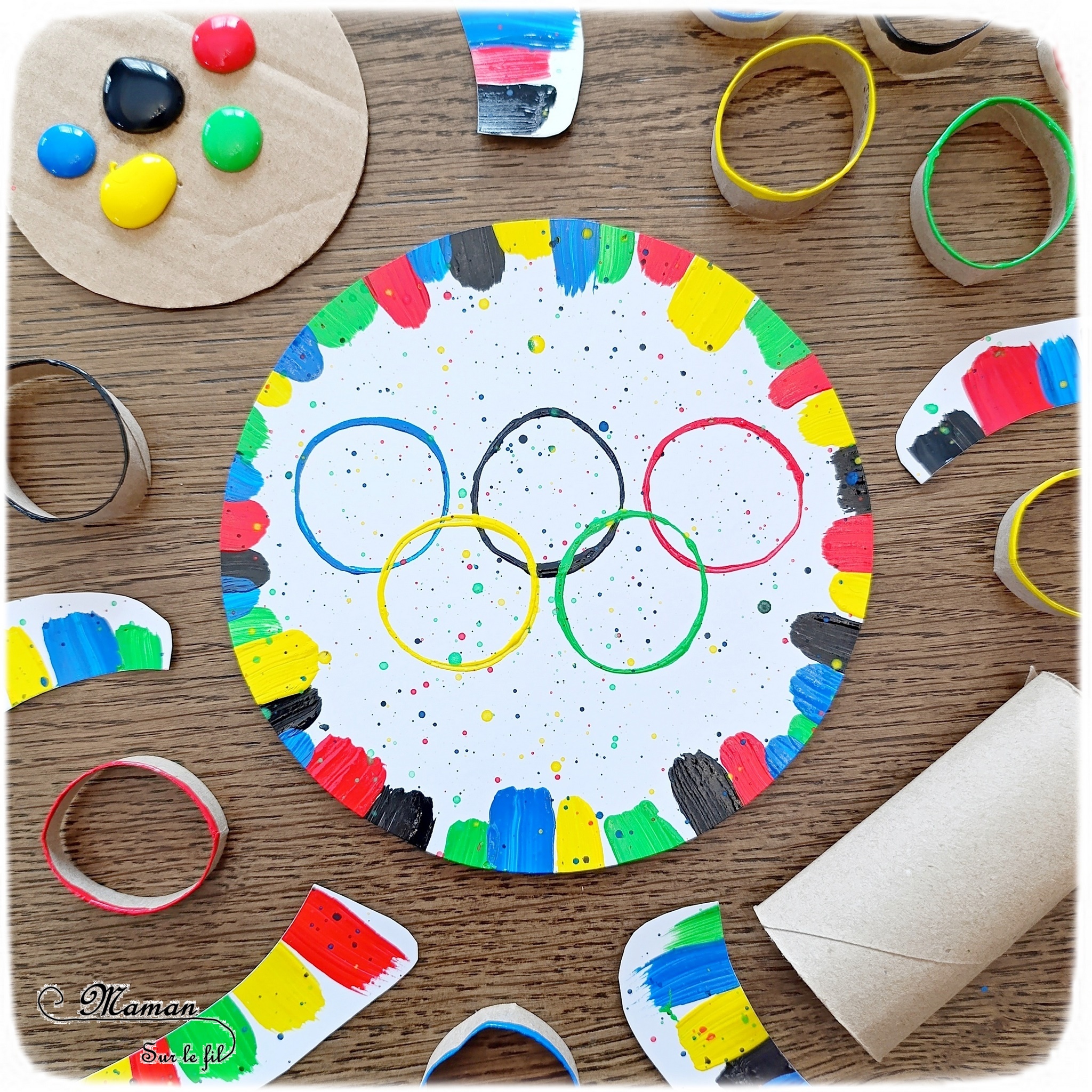 Peindre les anneaux olympiques avec un rouleau de PQ en carton : activité créative, peinture et manuelle enfants - Peinture avec des rouleaux de papier toilettes en carton et un pinceau - Peinture éclaboussée et aquarelle - Recyclage et surcyclage - Ronds, cercles, géométrie - Thème jeux olympiques, sports - Bricolage sympa et facile - Arts visuels Maternelle et cycle 2 - Arts visuels et atelier Maternelle et élémentaire - Créativité - Cycle 1 ou 2 - tutoriel photos - mslf