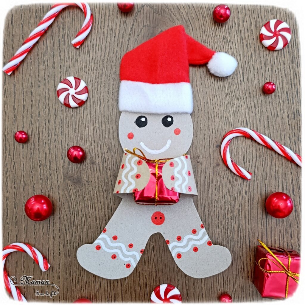 Fabriquer un bonhomme en pain d'épices en récup' avec son petit cadeau dans les bras : activité créative, récup' et manuelle enfants - Bricolage et décoration en carton - Découpage, dessin, graphismes, bonnet de Noël - Suspension DIY pour le sapin -Fait Maison - Thème Noël, hiver, gourmandises - Bricolage et décoration sympa et facile - Arts visuels Maternelle et cycle 2 - Maternelle et élémentaire - Créativité - Cycle 1 ou 2 - tutoriel photos - mslf