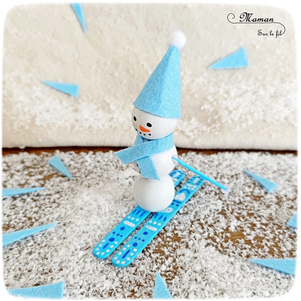 Fabriquer un bonhomme de neige qui fait du ski : activité créative et manuelle enfants - Bricolage avec des perles, des bâtonnets de glace en bois et de la feutrine - Récup, recyclage, surcyclage - Décoration hivernale - Thème hiver, montagne, neige, sports d'hiver - Bricolage et décoration sympa et facile - Arts visuels Maternelle et cycle 2 - Maternelle et élémentaire - Créativité - Cycle 1 ou 2 - tutoriel photos - mslf