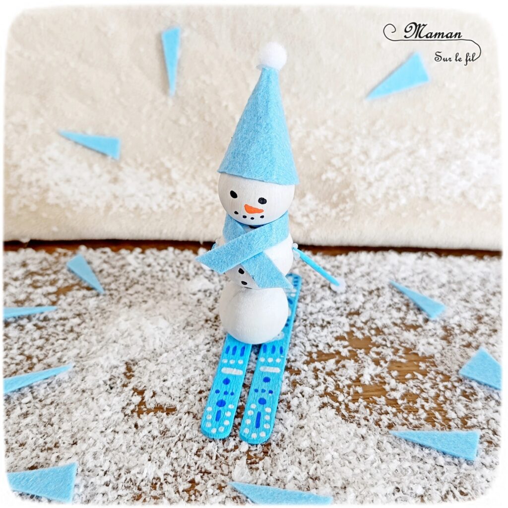 Fabriquer un bonhomme de neige qui fait du ski : activité créative et manuelle enfants - Bricolage avec des perles, des bâtonnets de glace en bois et de la feutrine - Récup, recyclage, surcyclage - Décoration hivernale - Thème hiver, montagne, neige, sports d'hiver - Bricolage et décoration sympa et facile - Arts visuels Maternelle et cycle 2 - Maternelle et élémentaire - Créativité - Cycle 1 ou 2 - tutoriel photos - mslf